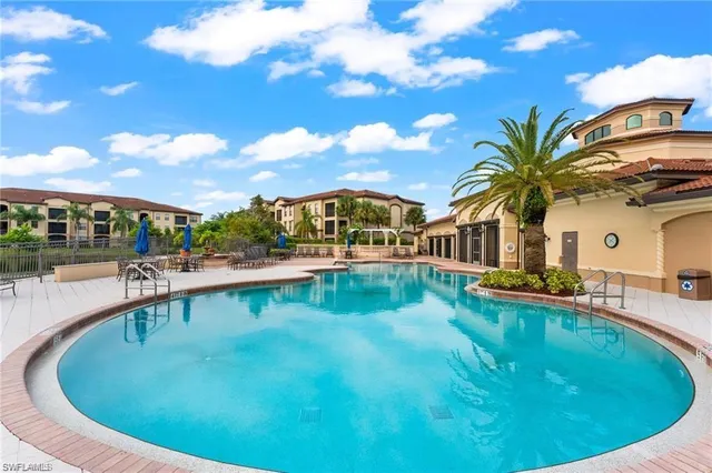 a view of a swimming pool with a patio