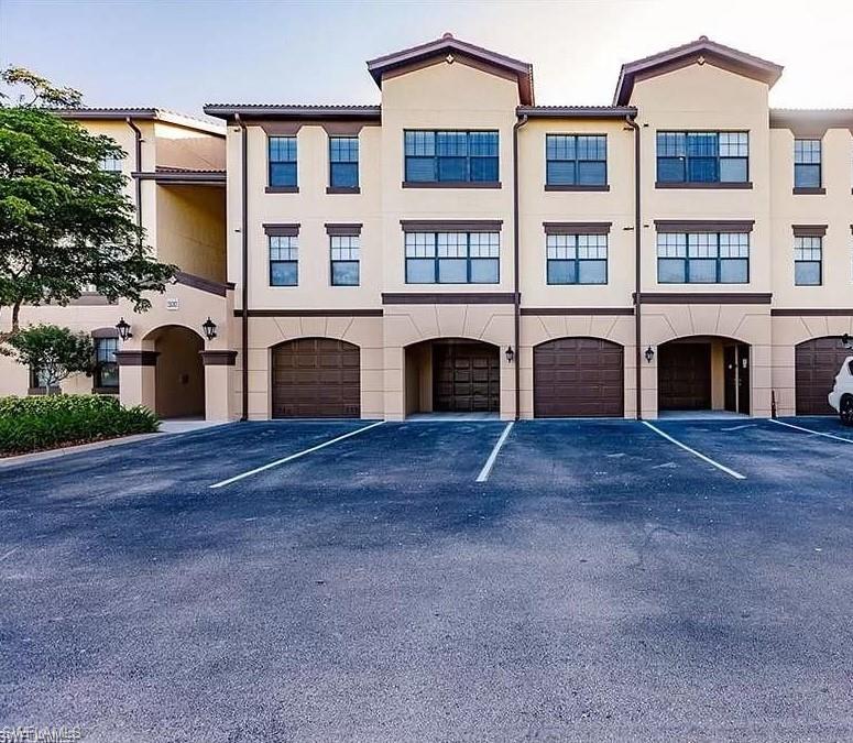 12975 Positano Circle, Unit 202 Naples, FL 34105 - Photo 13 of 14 a view of outdoor space and front view of a house