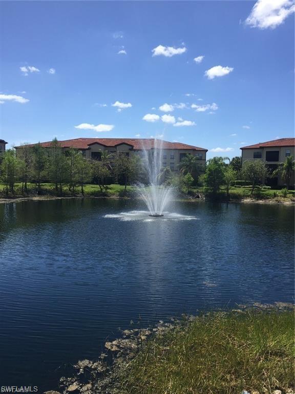 12975 Positano Circle, Unit 202 Naples, FL 34105 - Photo 9 of 14 a view of lake with mountain