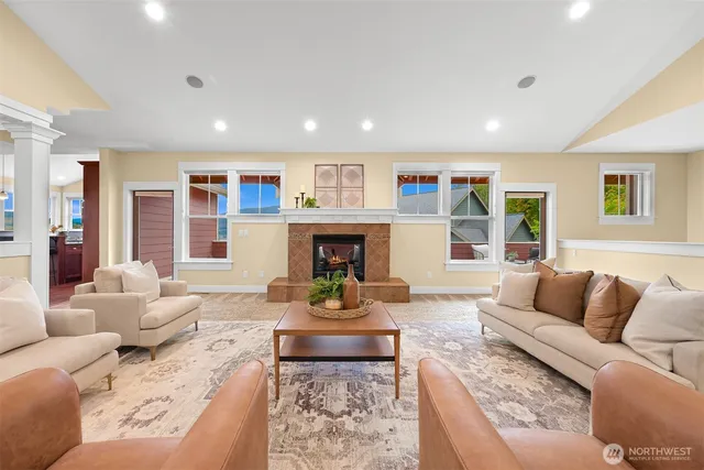 a living room with furniture and a fireplace
