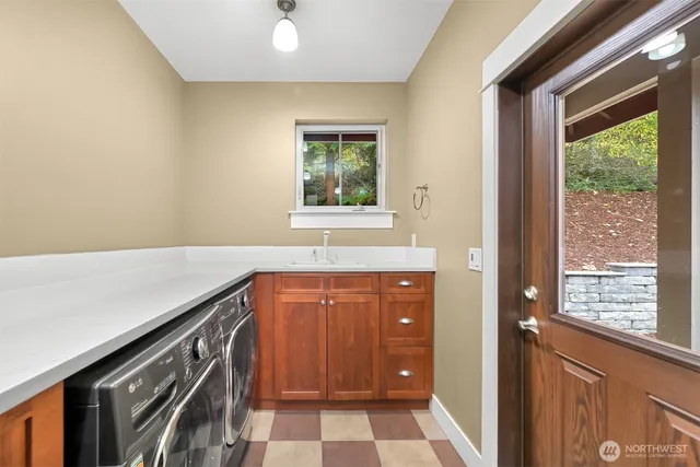 a view of a sink and a window