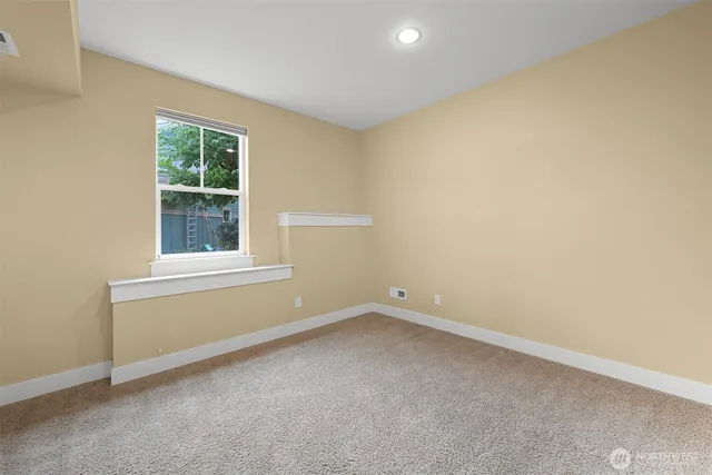 a bathroom with a granite countertop sink a mirror and a shower