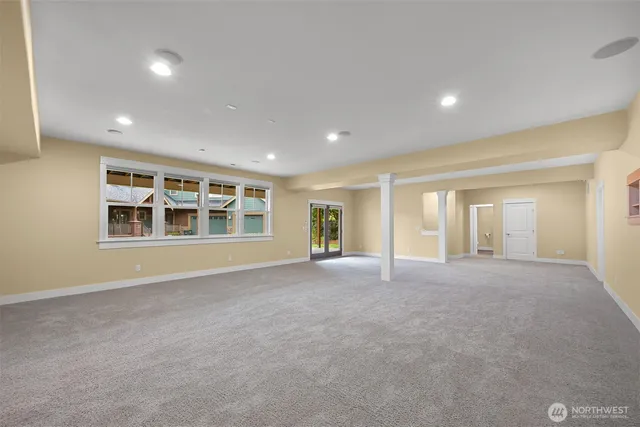 a living room with furniture and potted plants