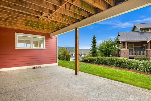 a view of a backyard with sitting area