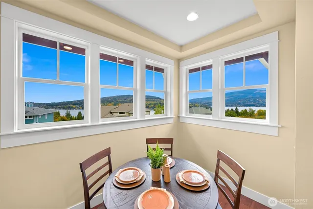 a view of a dining room with furniture window and outdoor view