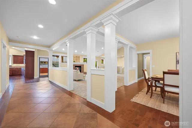 a view of a living room kitchen and a dining table chair
