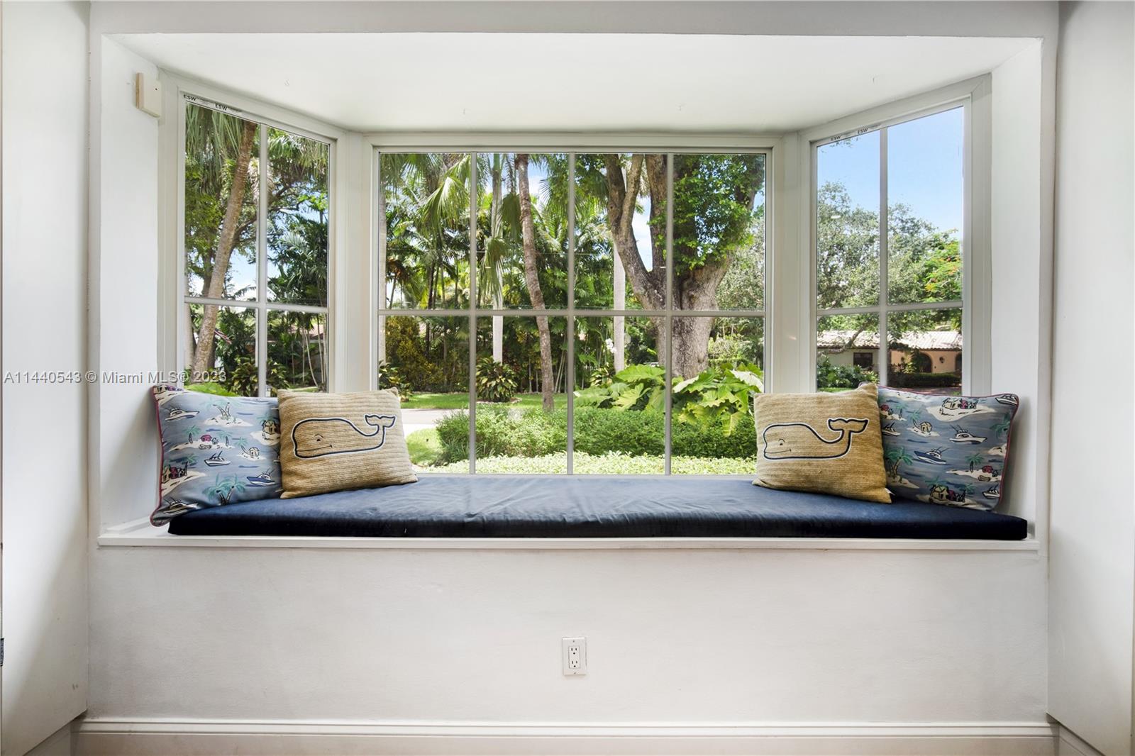13001 Southwest 70th Avenue Pinecrest, FL 33156 - Photo 12 of 49 a view of a living room with a large window