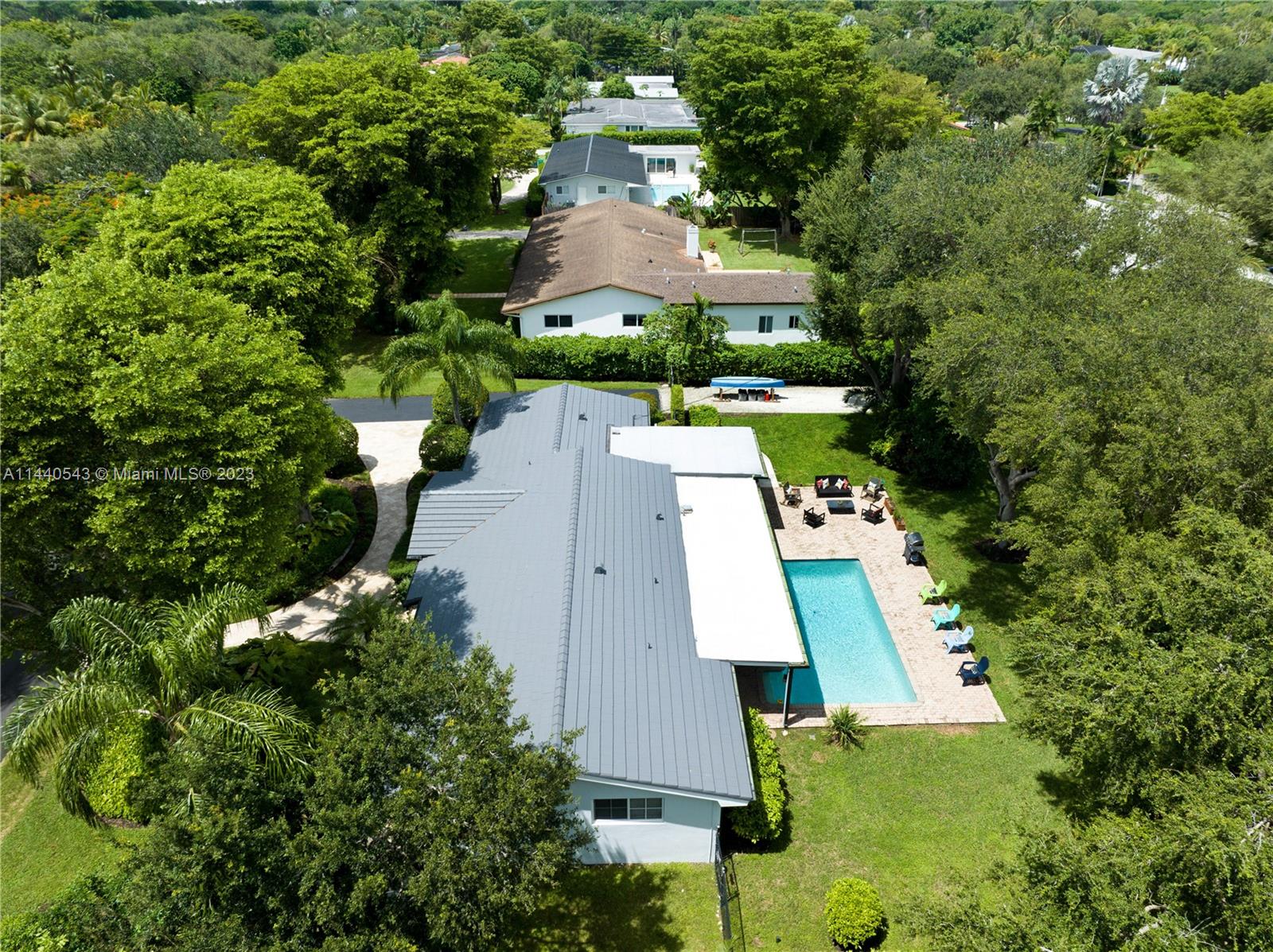 13001 Southwest 70th Avenue Pinecrest, FL 33156 - Photo 49 of 49 an aerial view of a house