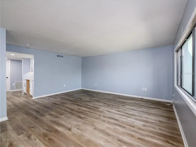 a view of an empty room and window