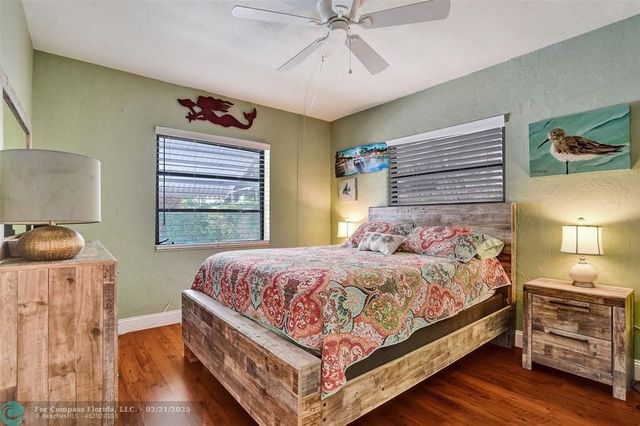 a bedroom with a bed and a table in it