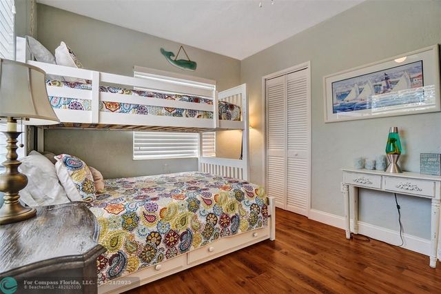 an aerial view of a house with a yard and plants