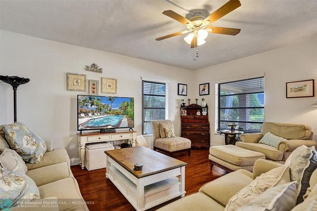 a kitchen with stainless steel appliances granite countertop a refrigerator a stove top oven a sink and dishwasher