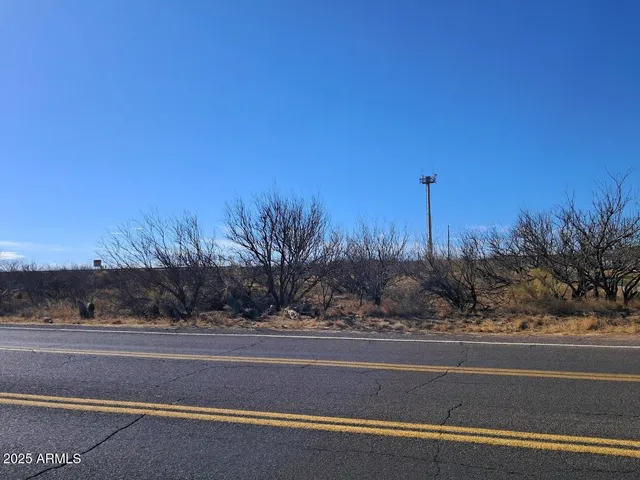 a view of a yard and ocean view