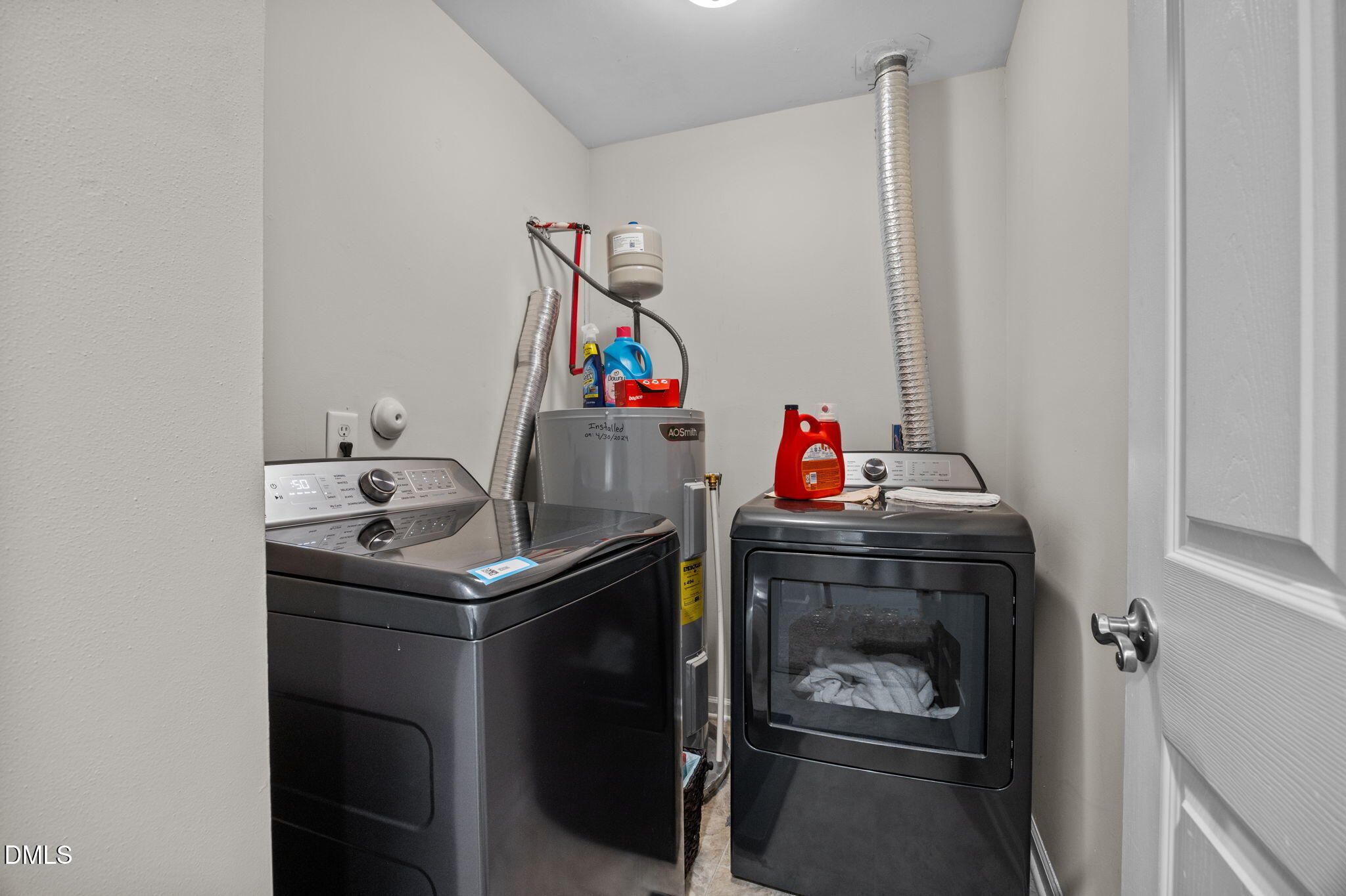5011 Eagle Stone Lane, Unit 106 Raleigh, NC 27610 - Photo 11 of 21 a utility room with dryer and washer