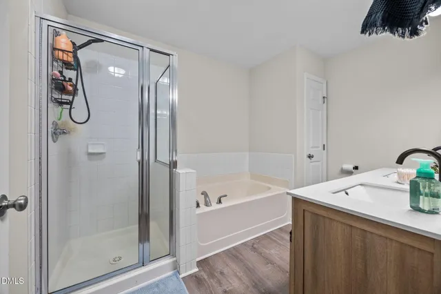 a bathroom with a tub and a shower