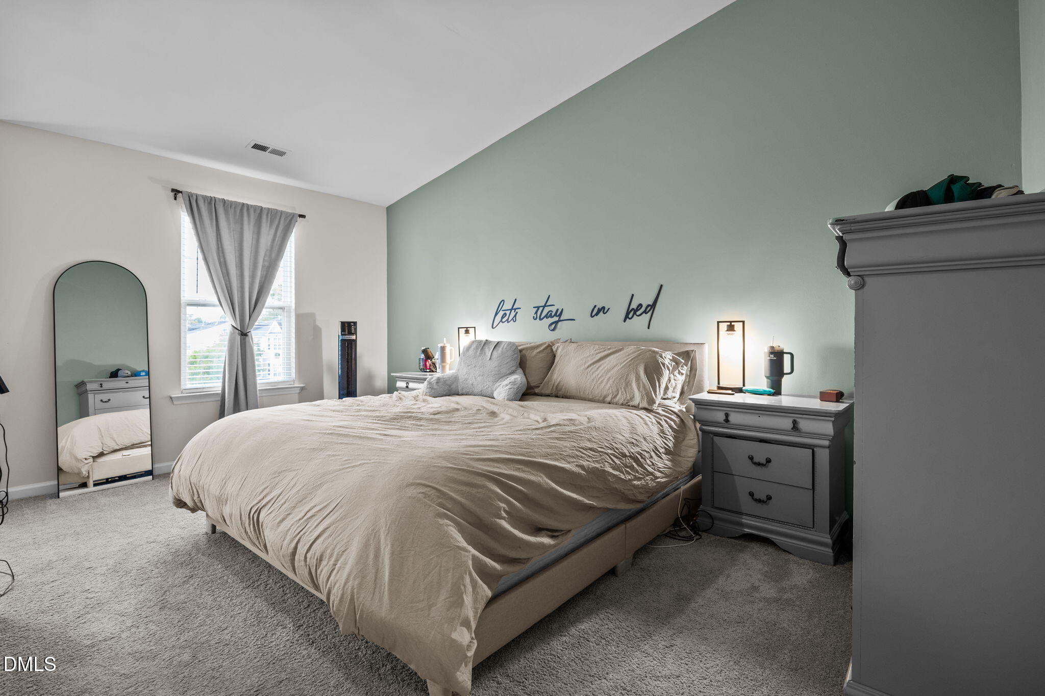 5011 Eagle Stone Lane, Unit 106 Raleigh, NC 27610 - Photo 19 of 21 a bedroom with a bed and a window