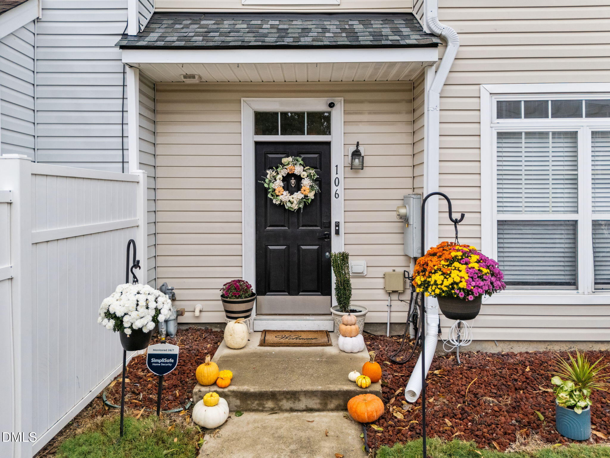 5011 Eagle Stone Lane, Unit 106 Raleigh, NC 27610 - Photo 2 of 21 a view of a entryway with flower pots