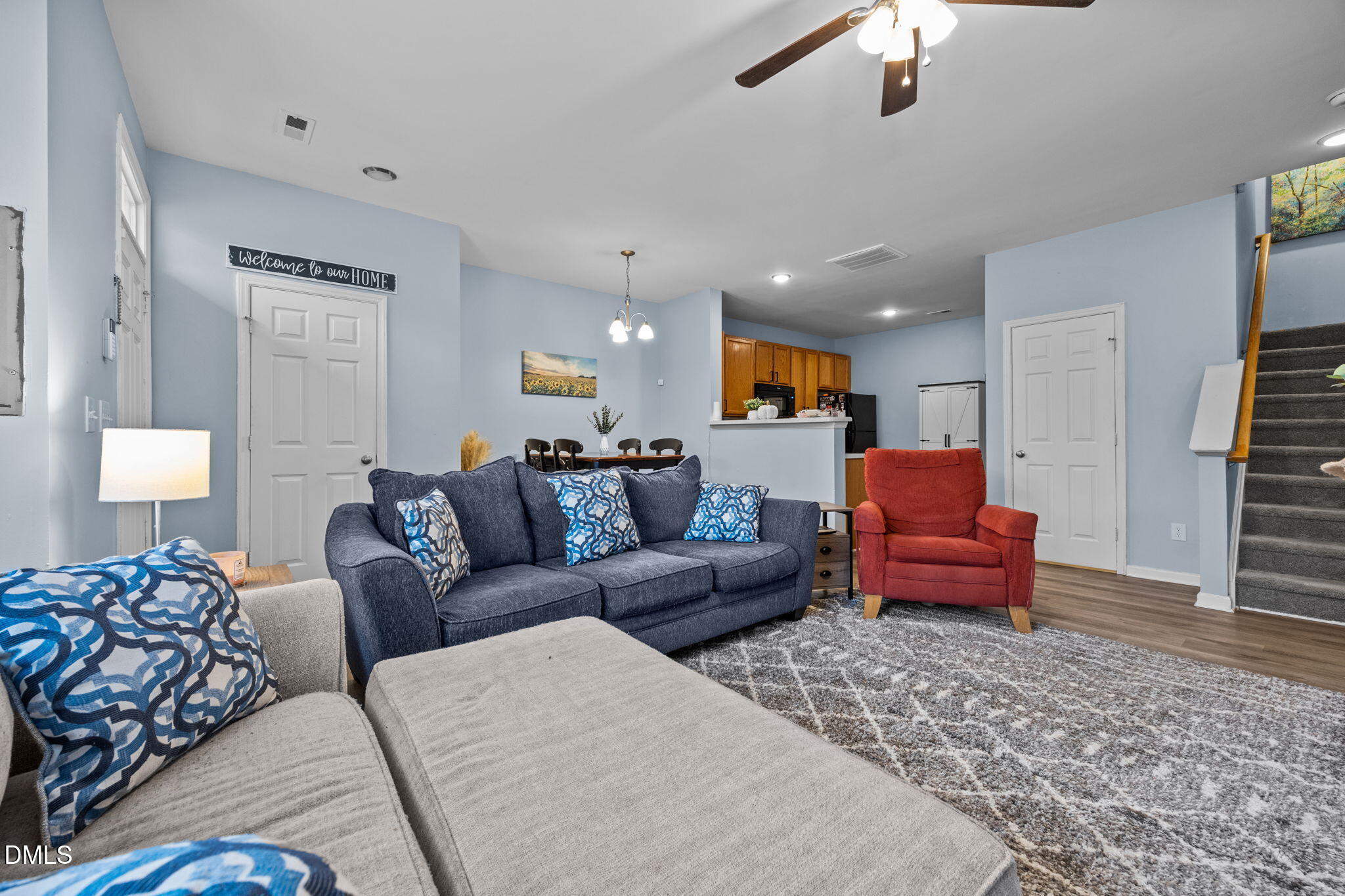5011 Eagle Stone Lane, Unit 106 Raleigh, NC 27610 - Photo 4 of 21 a living room with furniture or couch and a chandelier