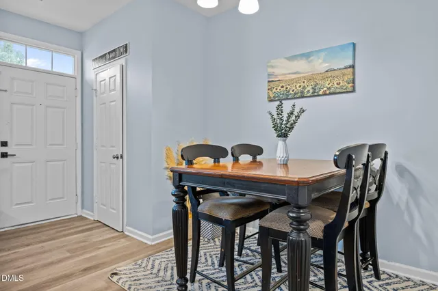 a view of a dining room with furniture and window