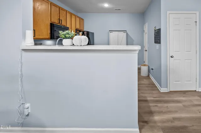 a view of a kitchen from the hallway
