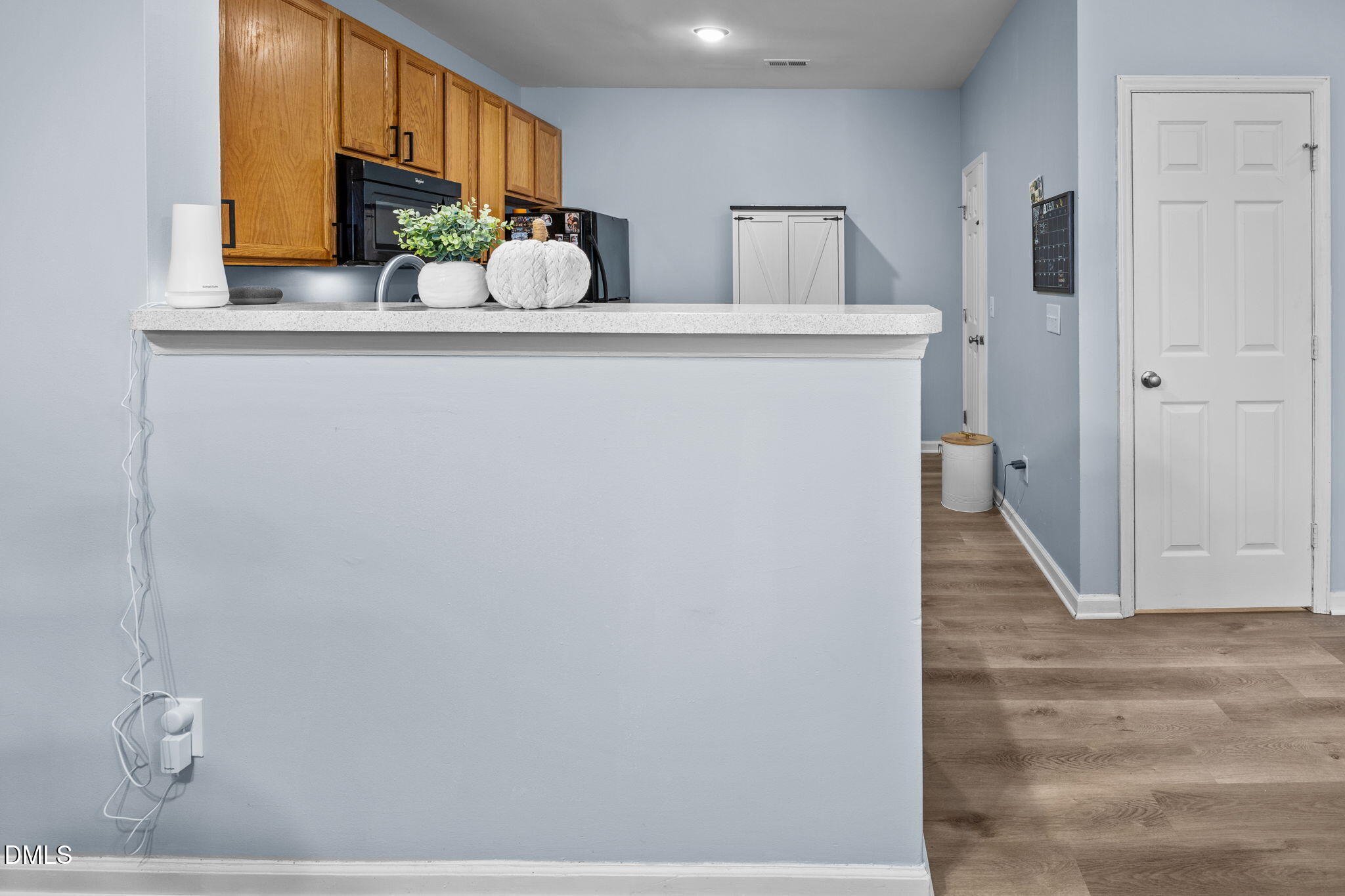 5011 Eagle Stone Lane, Unit 106 Raleigh, NC 27610 - Photo 9 of 21 a view of a kitchen from the hallway