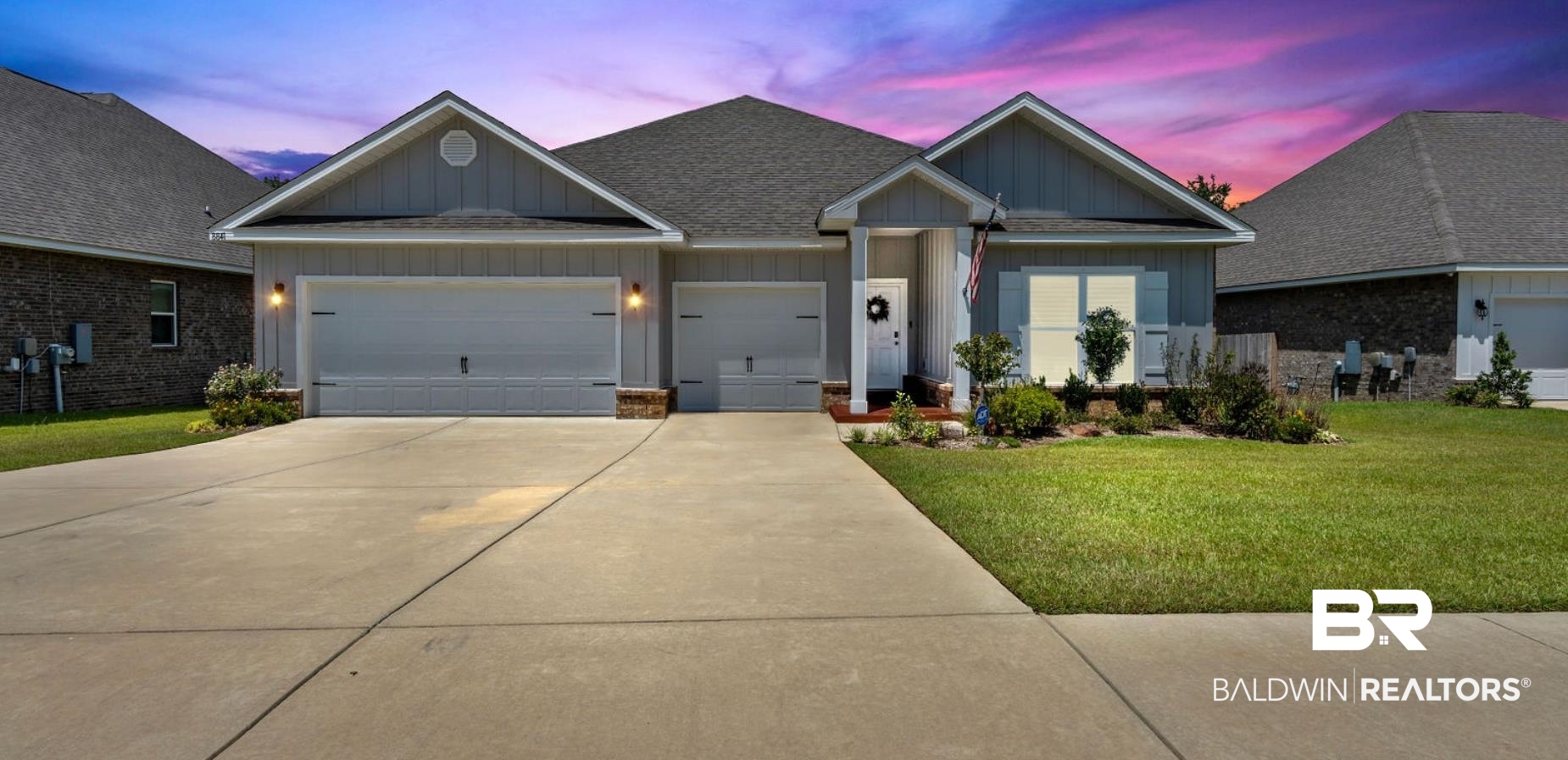 8841 Calverton Street Foley, AL 36535 - Photo 2 of 51 View of front of house with a garage and a yard