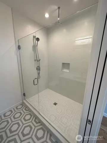 a bathroom with a shower and toilet