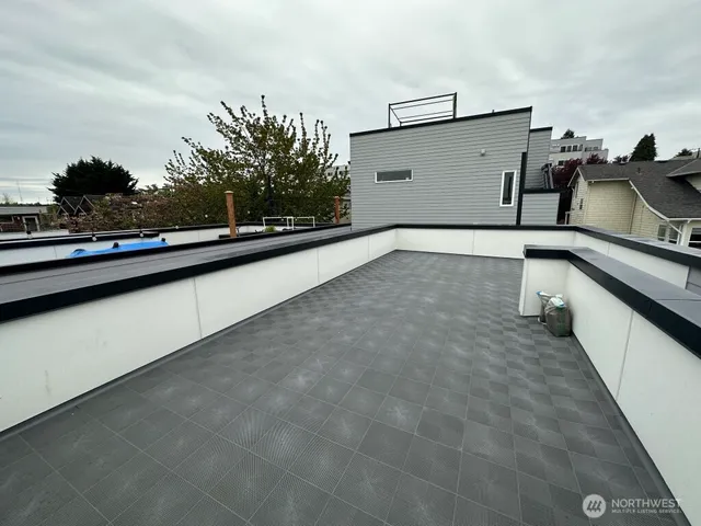 a kitchen with kitchen island a sink and stove