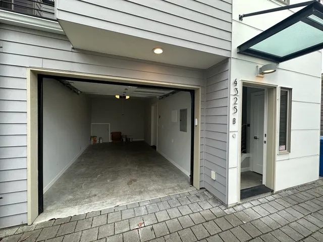 a view of a hallway with wooden walls and entryway