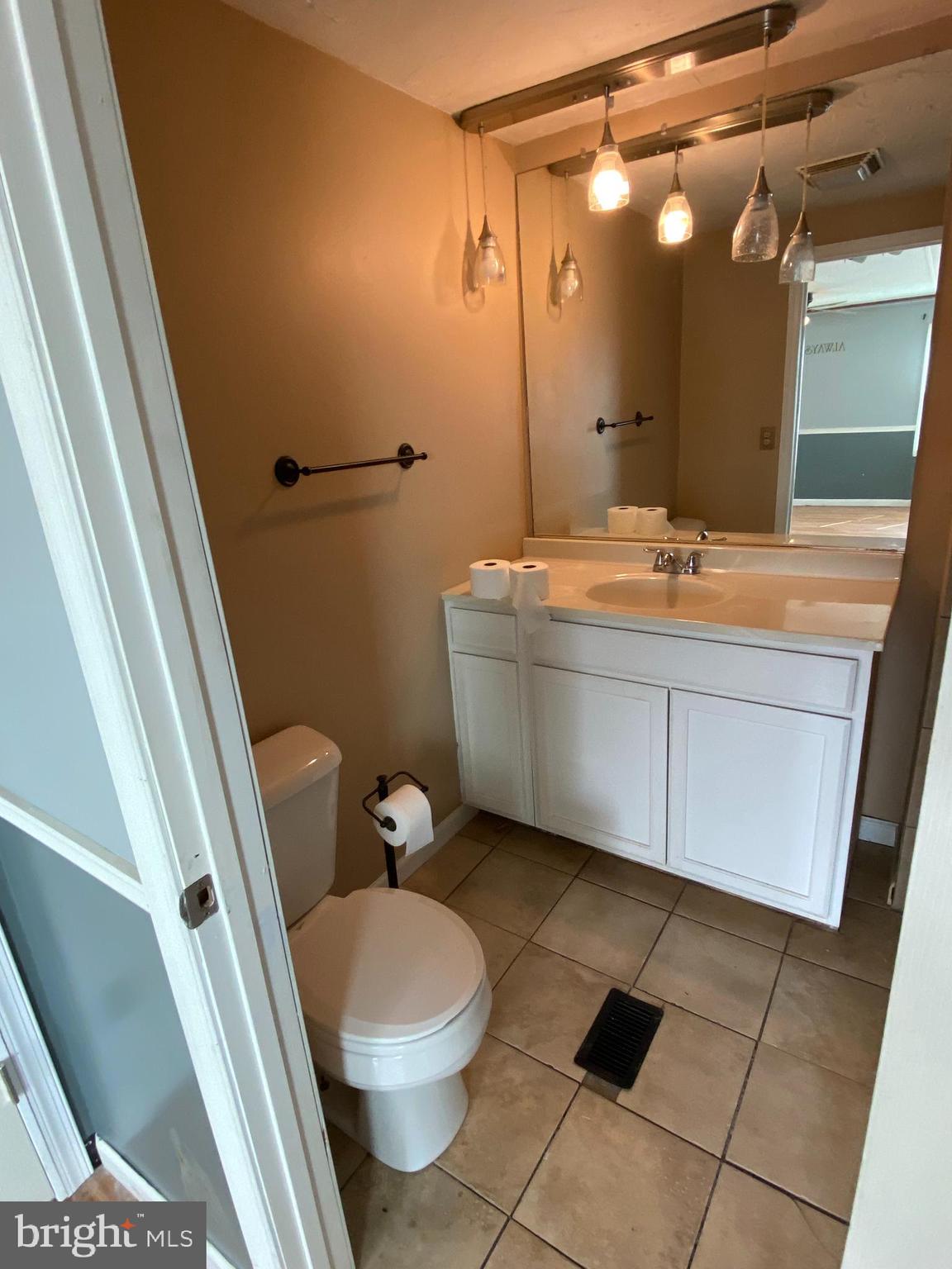 29 Chesapeake Estates York, PA 17408 - Photo 11 of 34 a bathroom with a granite countertop sink mirror vanity and toilet