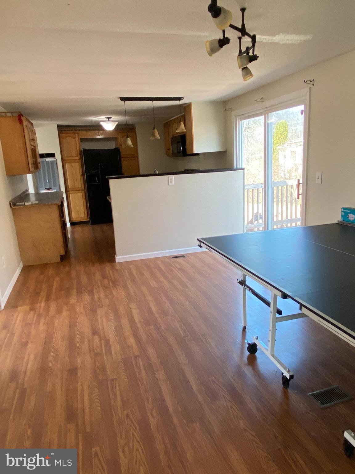 29 Chesapeake Estates York, PA 17408 - Photo 15 of 34 a view of a kitchen with a sink hardwood floor and a ceiling fan