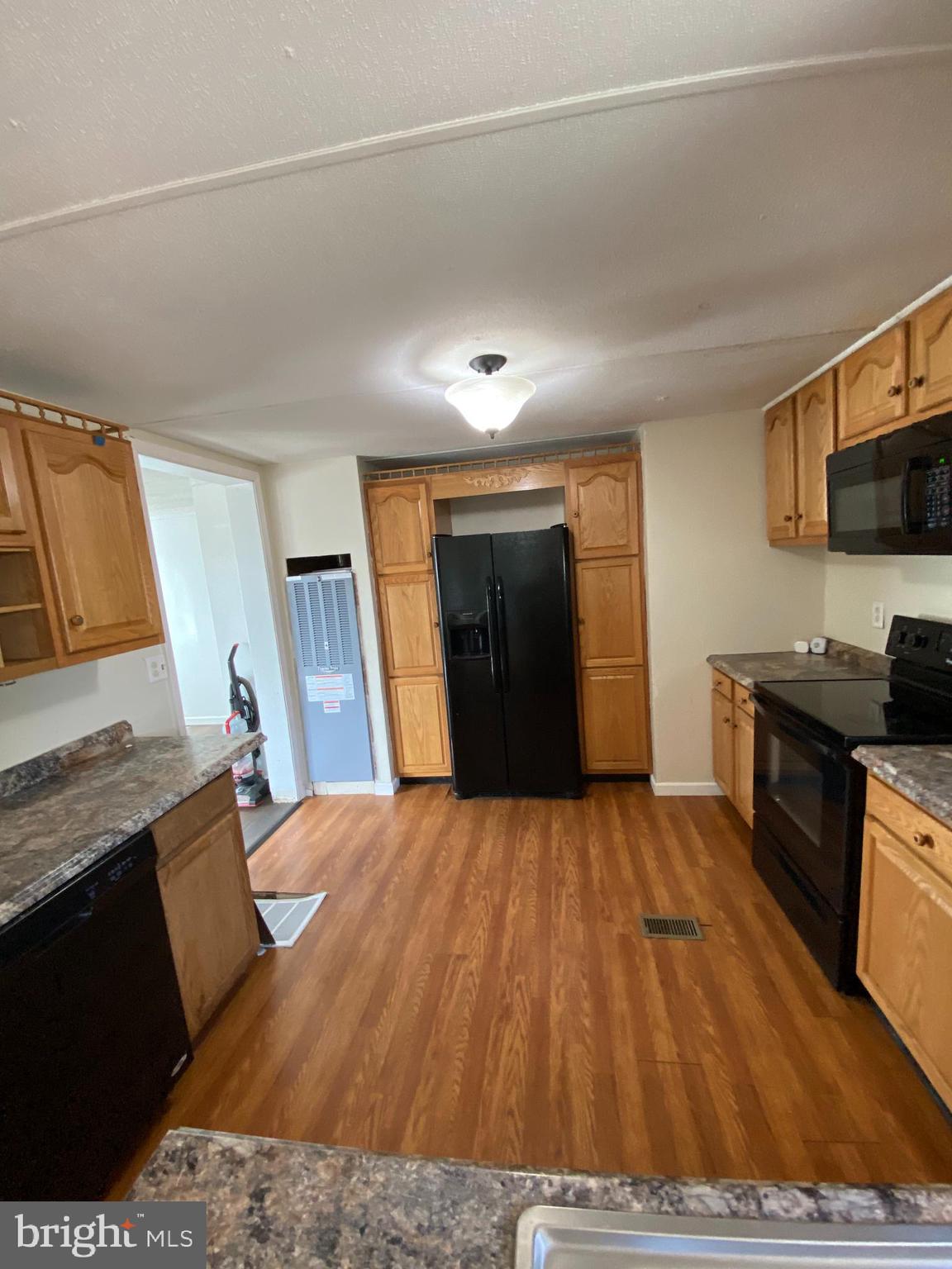 29 Chesapeake Estates York, PA 17408 - Photo 18 of 34 a large bedroom with a bed and a flat screen tv