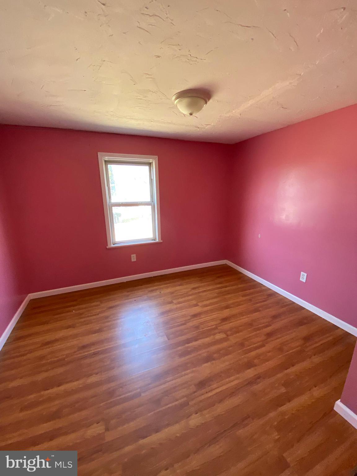 29 Chesapeake Estates York, PA 17408 - Photo 26 of 34 an empty room with wooden floor and windows