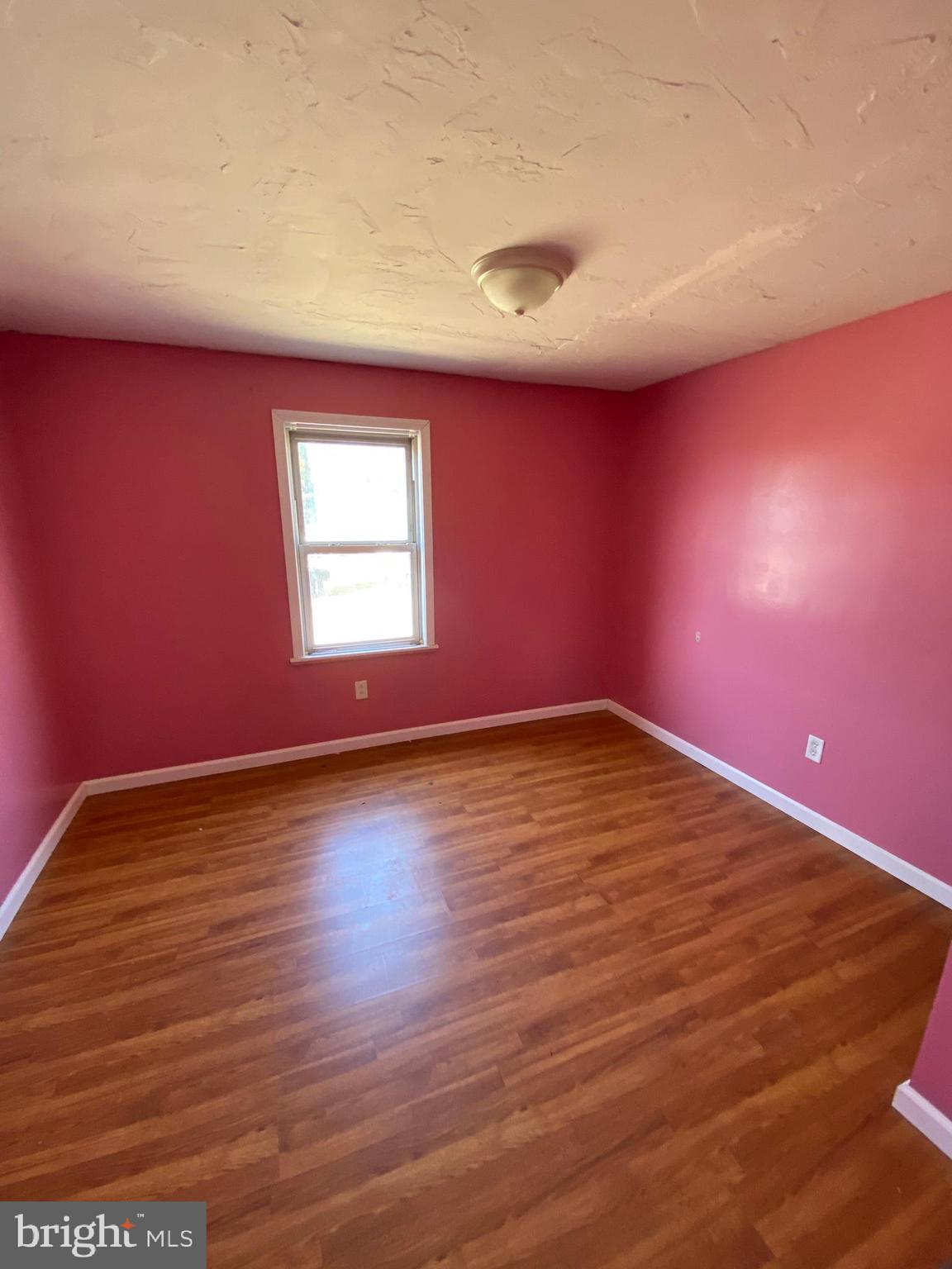 29 Chesapeake Estates York, PA 17408 - Photo 27 of 34 an empty room with wooden floor and windows