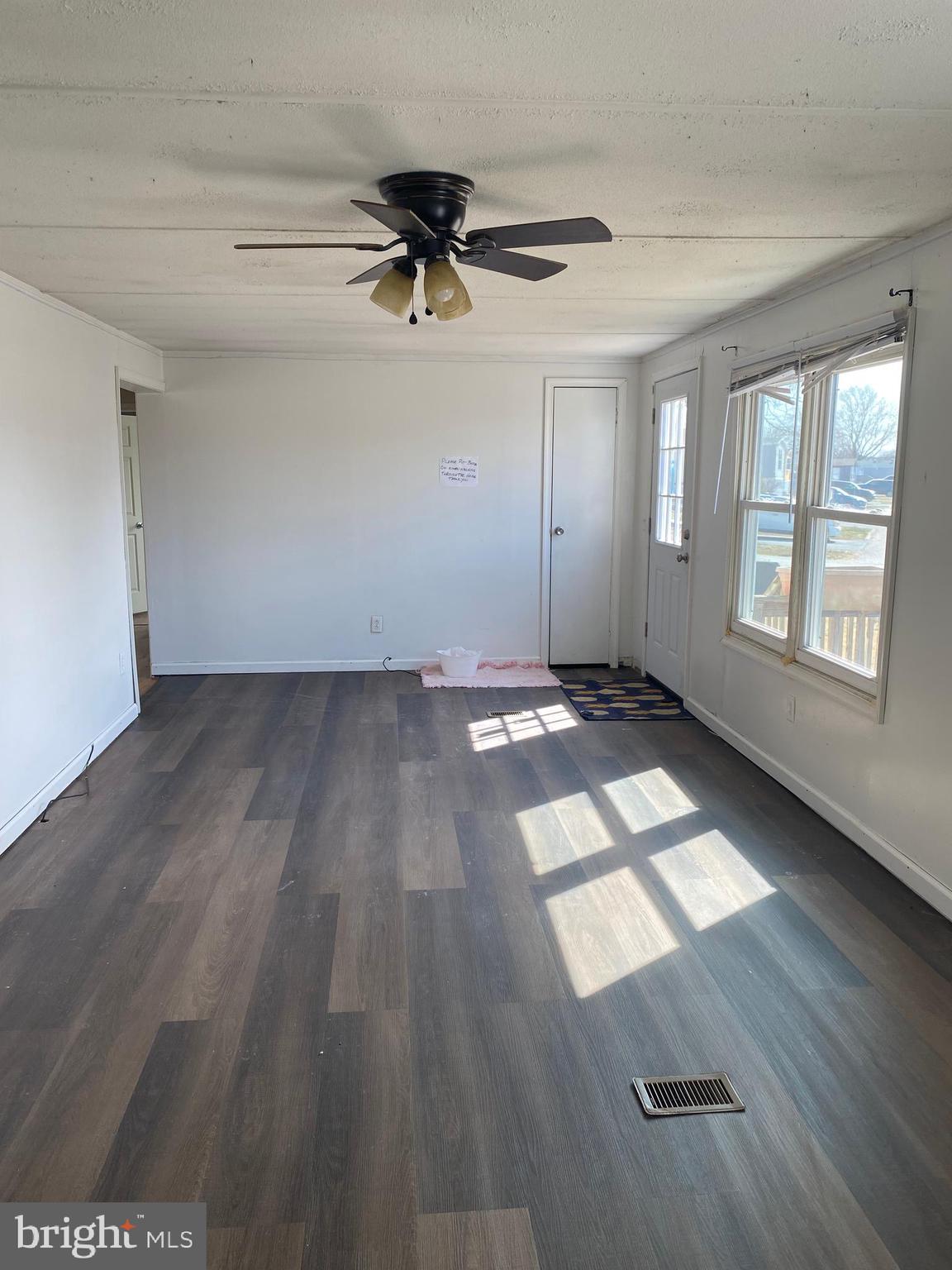 29 Chesapeake Estates York, PA 17408 - Photo 9 of 34 wooden floor in an empty room with a window