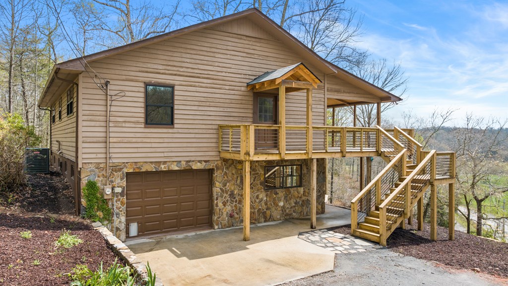 1657 Barnes Chapel Road Blue Ridge, GA 30513 - Photo 17 of 37 a view of a house with a yard