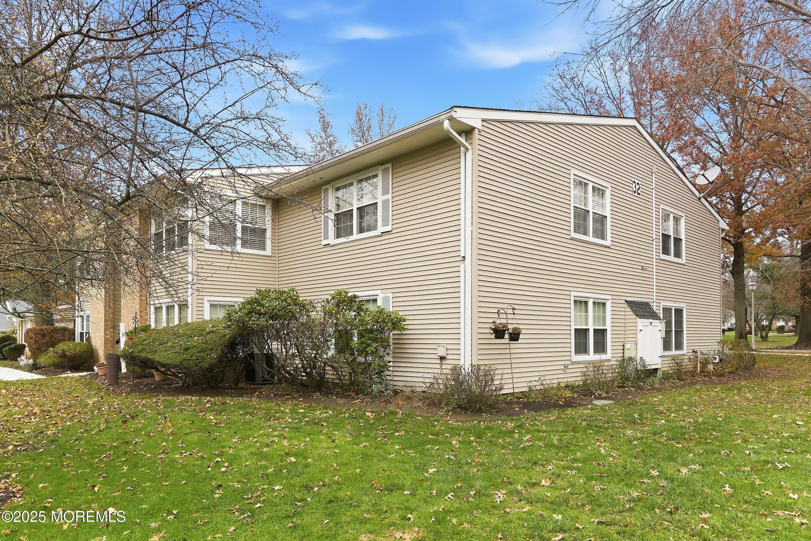 7 Boxwood Terrace, Unit 250 Red Bank, NJ 07701 - Photo 20 of 29 a view of a house with a yard