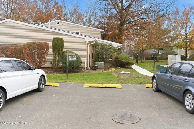 a view of house with backyard and outdoor seating
