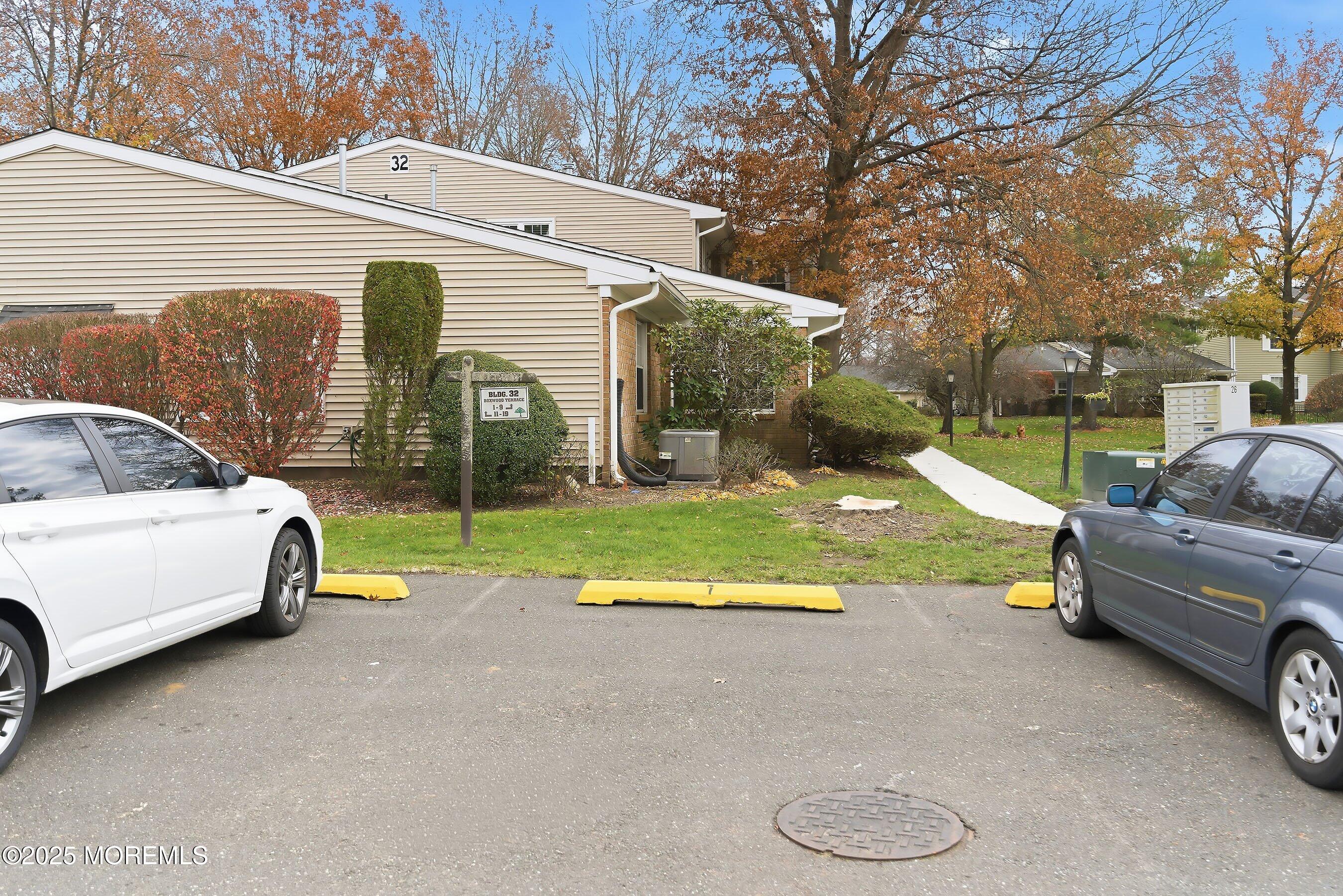 7 Boxwood Terrace, Unit 250 Red Bank, NJ 07701 - Photo 21 of 29 a view of house with backyard and outdoor seating