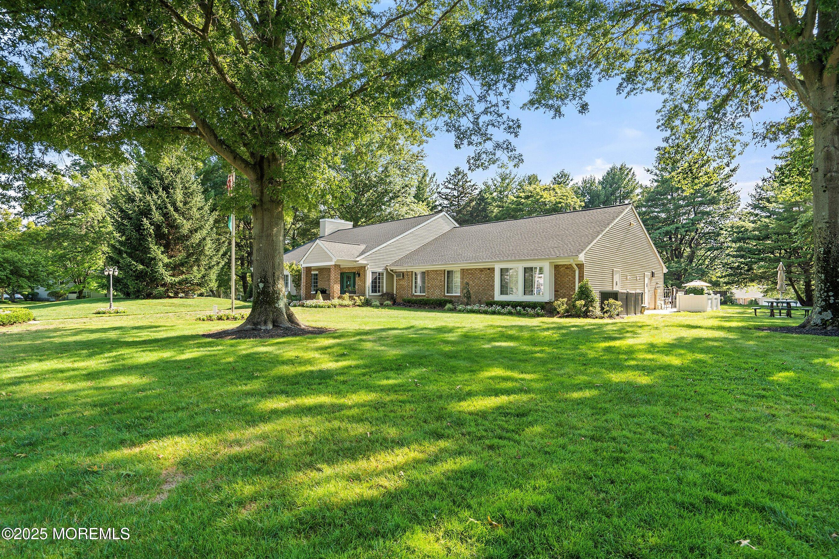 7 Boxwood Terrace, Unit 250 Red Bank, NJ 07701 - Photo 26 of 29 a front view of a house with a garden