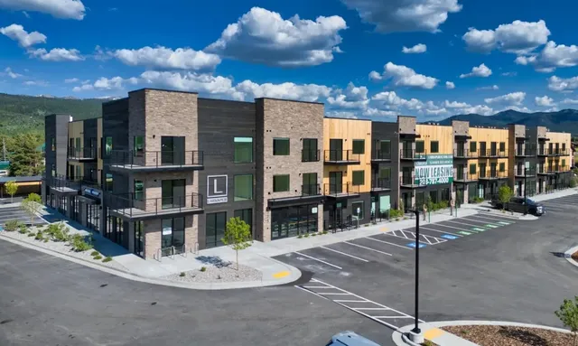 a view of a patio with dining table and chairs