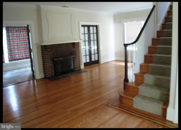 3902 Hadley Square West Baltimore, MD 21218 - Photo 25 of 30 a view of entryway and hall with wooden floor
