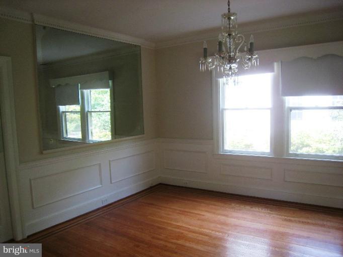 3902 Hadley Square West Baltimore, MD 21218 - Photo 5 of 30 a view of an empty room with a window