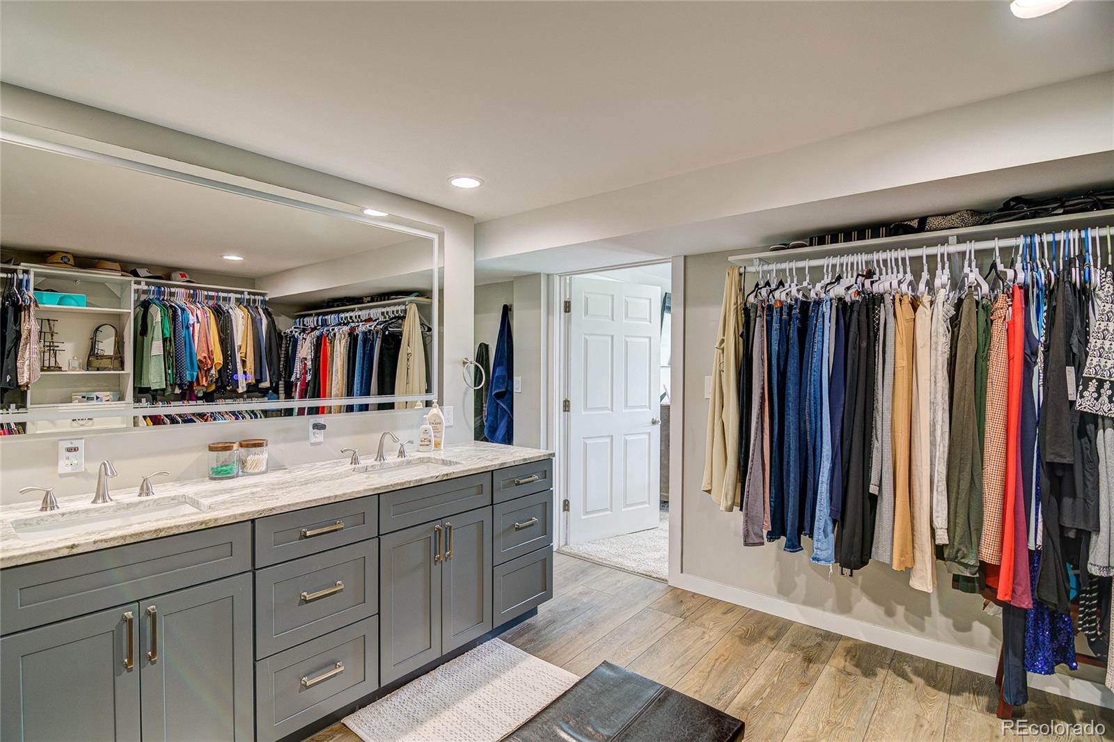 4531 East Best Road Larkspur, CO 80118 - Photo 15 of 49 a bathroom with a double vanity sink and a mirror