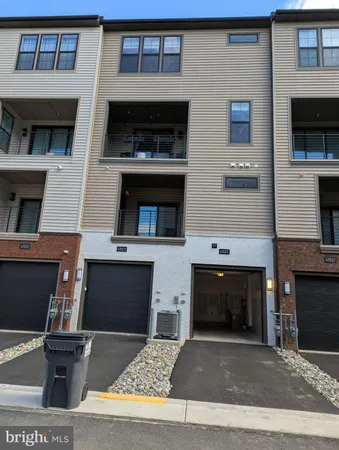 a living room with a fireplace a flat screen tv and a fireplace