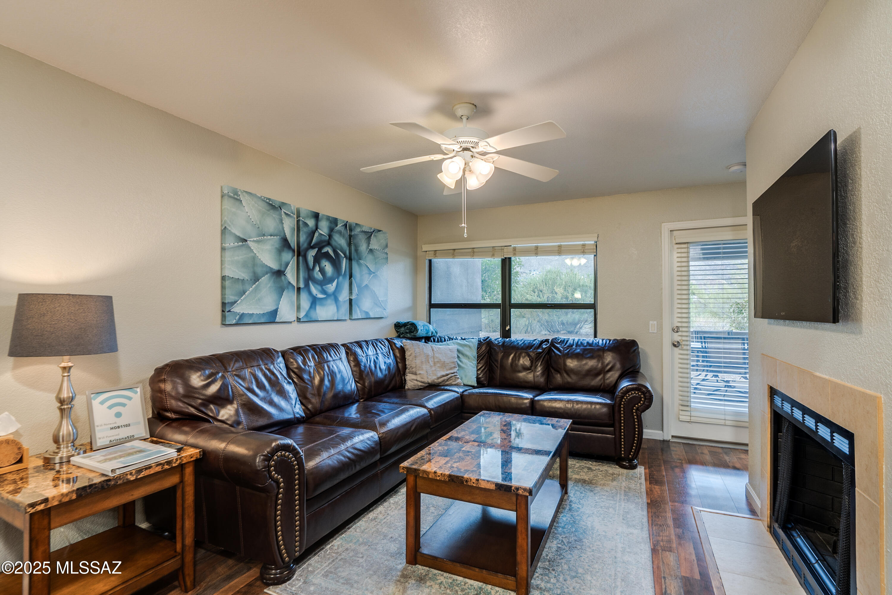 5855 North Kolb Road, Unit 1102 Tucson, AZ 85750 - Photo 5 of 26 Living Room with wood burning fireplace!