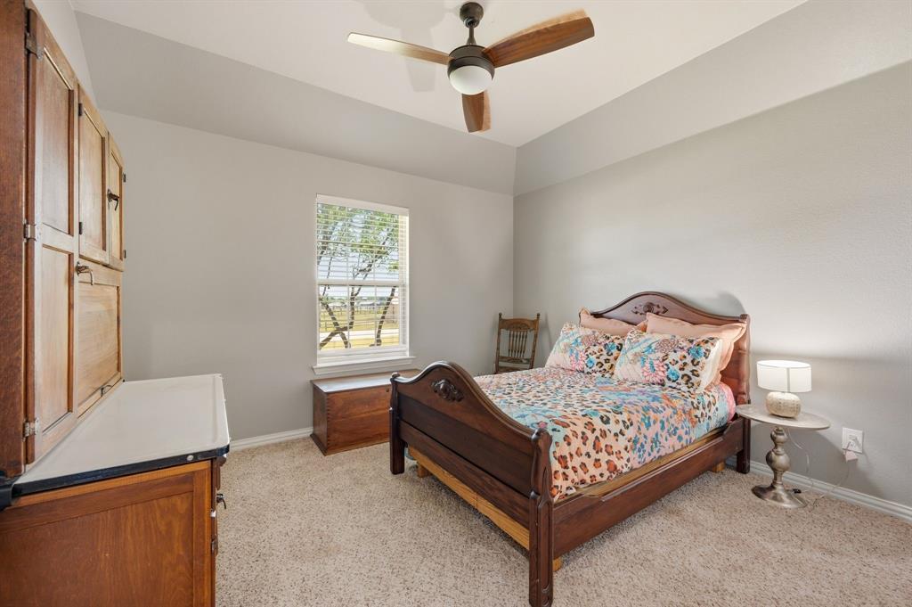 140 Heather Lane Decatur, TX 76234 - Photo 27 of 39 a bedroom with a bed and window