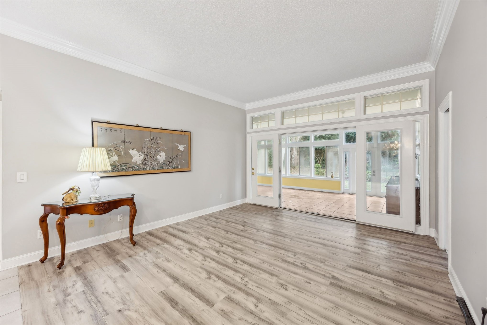 4433 Bean Street Fernandina Beach, FL 32034 - Photo 14 of 79 a view of empty room with wooden floor and fan