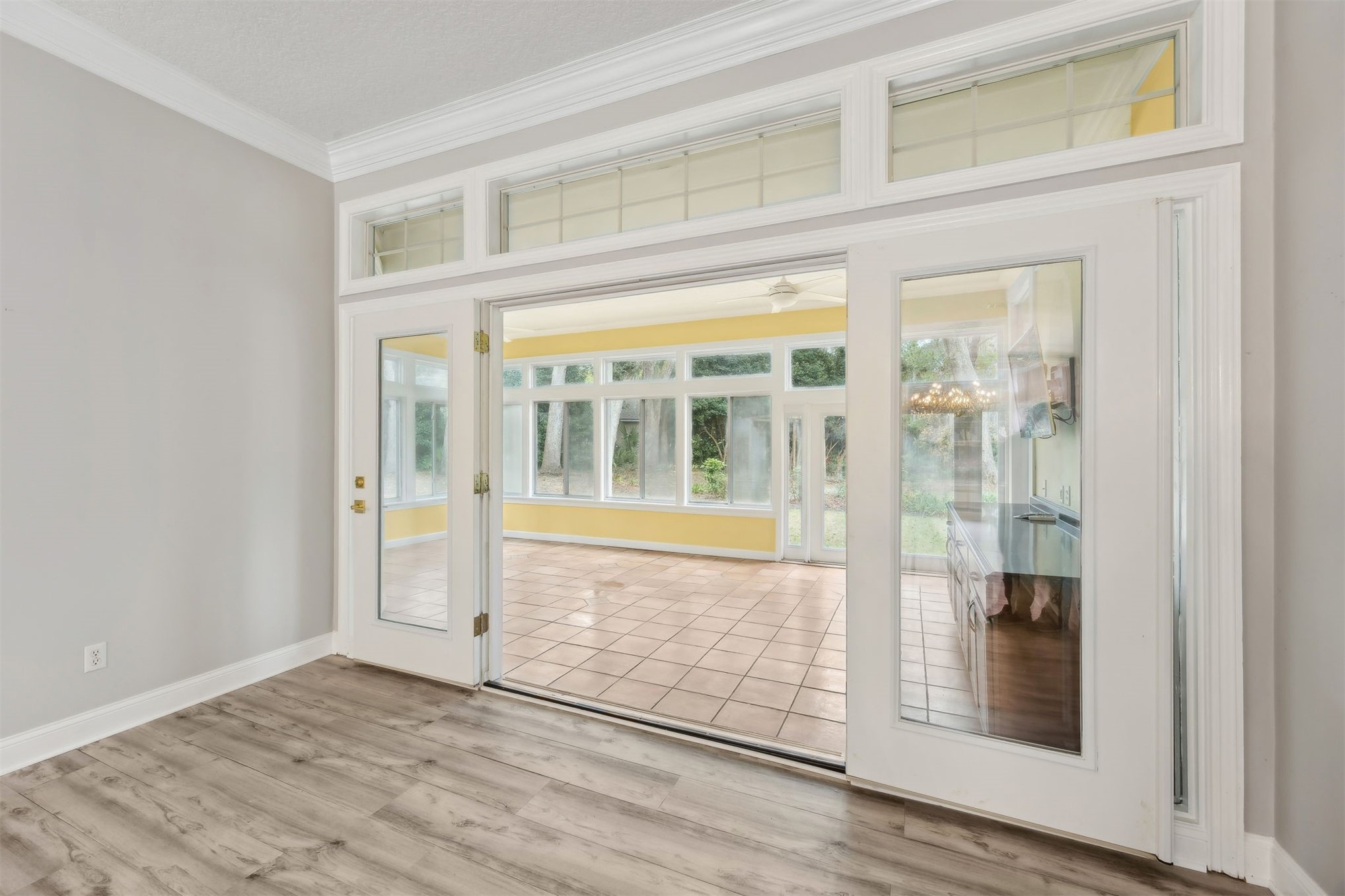 4433 Bean Street Fernandina Beach, FL 32034 - Photo 24 of 79 an empty room with wooden floor and windows