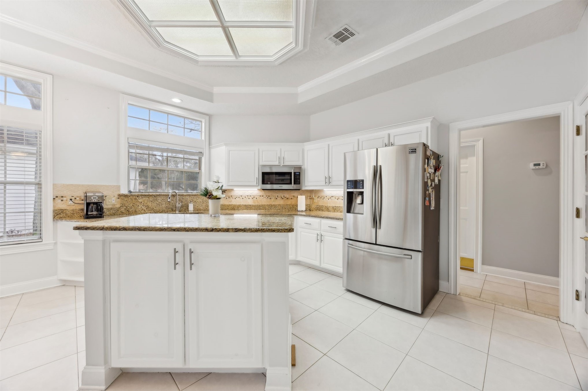 4433 Bean Street Fernandina Beach, FL 32034 - Photo 29 of 79 a kitchen with granite countertop cabinets and stainless steel appliances